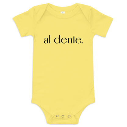 Product display image of the "Al Dente" baby onesie in yellow cotton, laid flat on a white background. Chunky Deli product image.