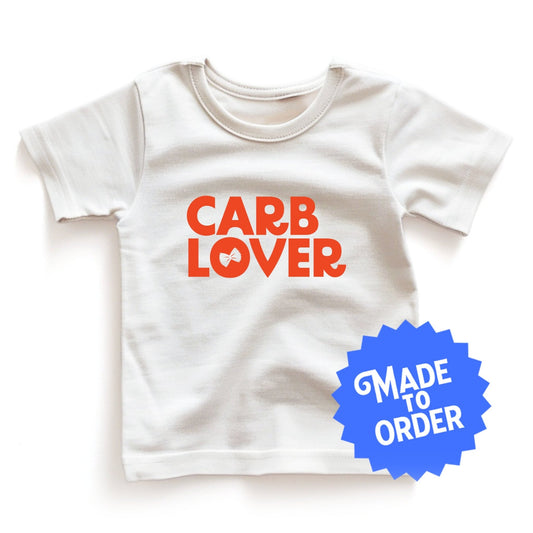 Chunky Deli product image: Natural-colored "Carb Lover" kids and toddler t-short 100% cotton laid flat on a white background.