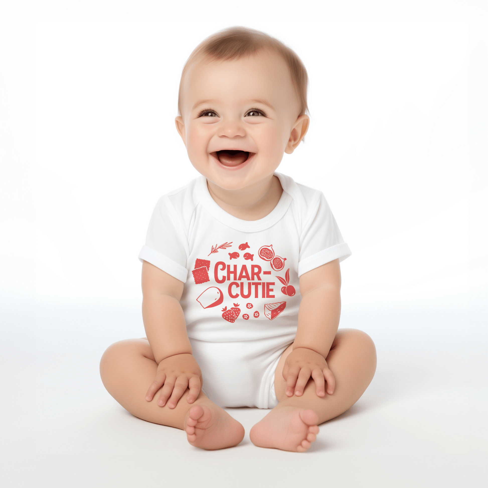 Chunky Deli product image: Happy, smiling baby wearing the "Charcutie" onesie, showcasing the short sleeves, envelope shoulder, and graphic design across the chest. White background.