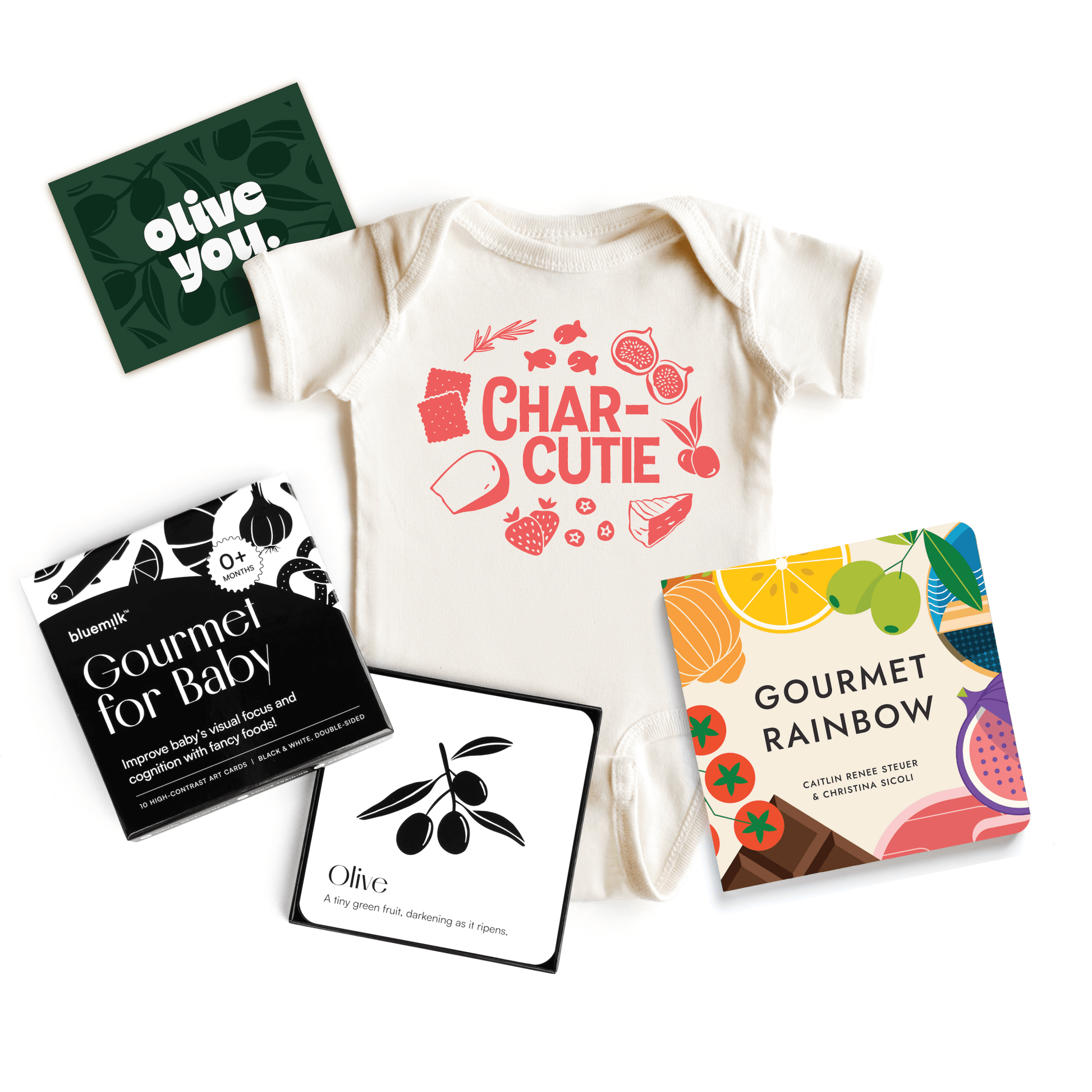 Chunky Deli product image: Charcutie Baby Gift Bundle, including the "Charcutie" baby onesie, "Gourmet Rainbow" board book, "Gourmet for Baby" high-contrast sensory cards, and the "Olive You" custom gift card, all laid flat on a white background.