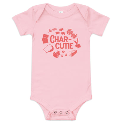 Chunky Deli product image: Pink-colored "Charcutie" onesie, 100% cotton with envelope shoulders and three-snap closure, laid flat on a white background.