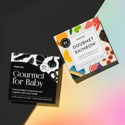 Chunky Deli product image: Set of two Gourmet art card collections displayed on a split background: "Gourmet for Baby" (black and white high-contrast cards) on a black background, and "Gourmet Rainbow" (colorful cards) on a rainbow background, highlightin