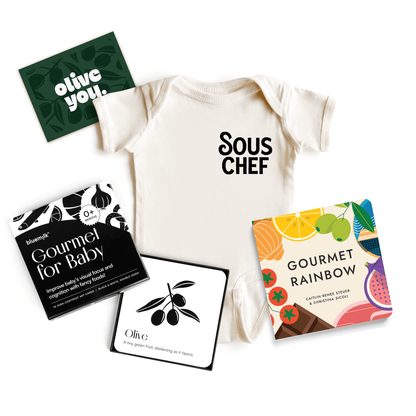 Chunky Deli product image: Gourmet Baby Gift Bundle, including the "Sous Chef" onesie (100% cotton, natural color), "Gourmet Rainbow" board book, "Gourmet for Baby" high-contrast black and white art cards for visual stimulation, and an "Olive You" gift no