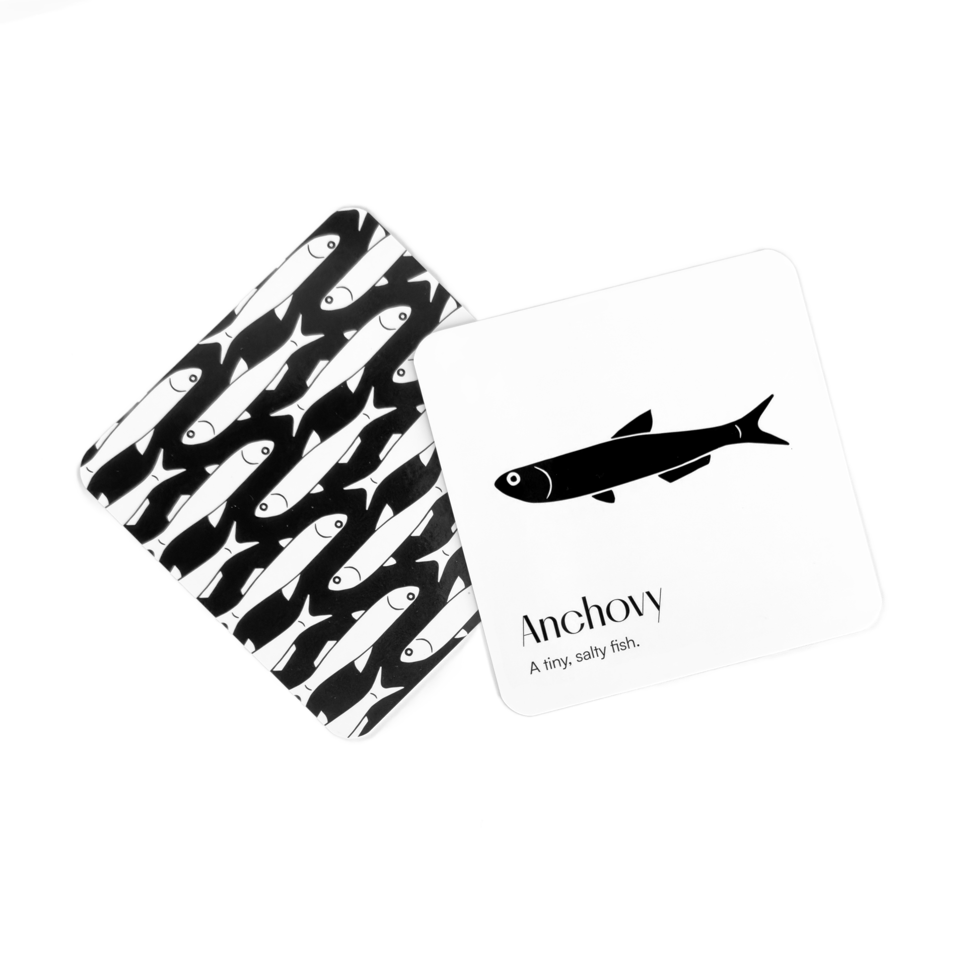 Chunky Deli product image: Two "Gourmet for Baby" black and white art cards featuring sardines: one card showing a repeating pattern of white sardines on black, the other showing a single black sardine on white. All on a white background.