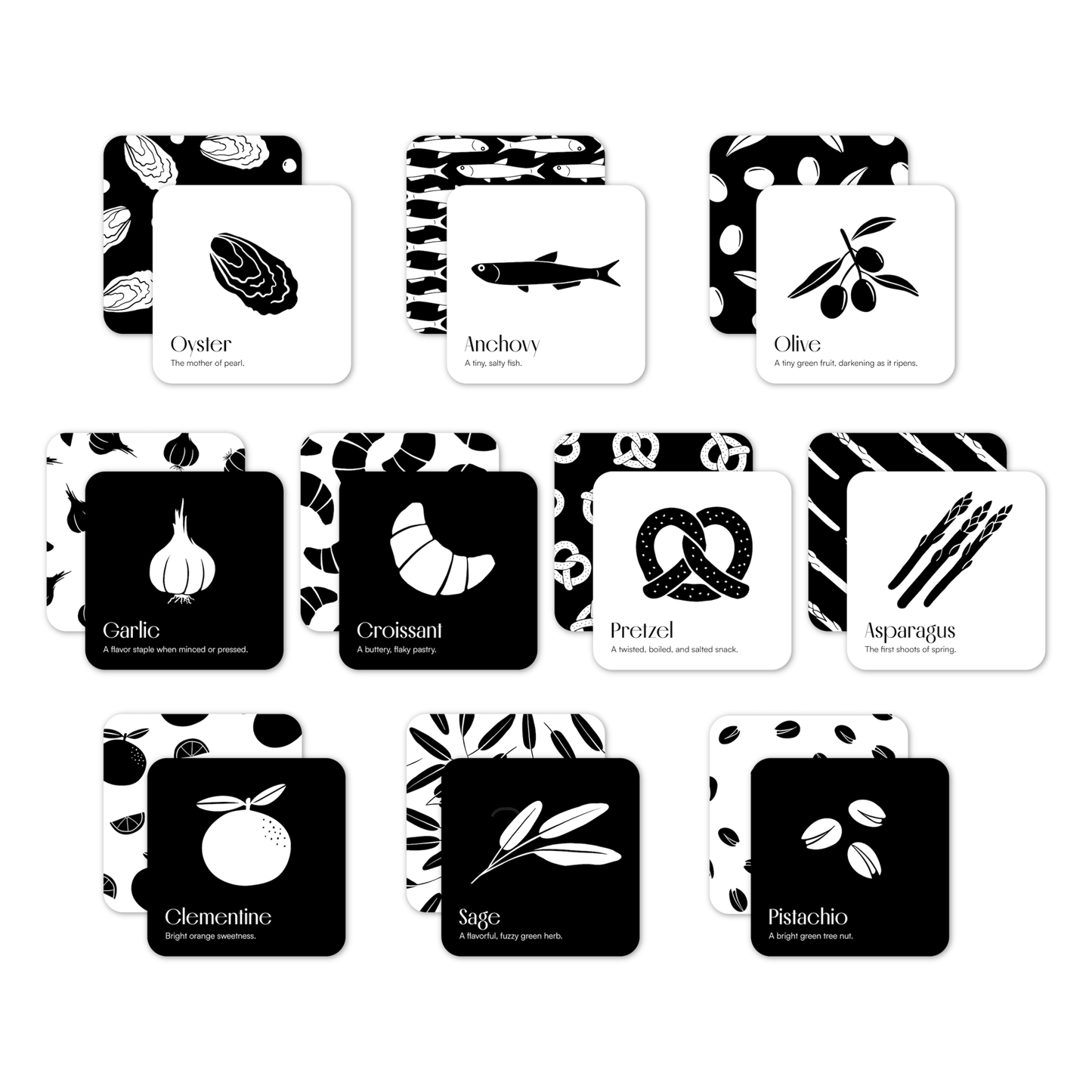 Chunky Deli product image: All cards from the "Gourmet for Baby" black and white art card set, arranged in a grid on a white background. Each card is shown in a stack, revealing both the repeating pattern side and the single illustration side.