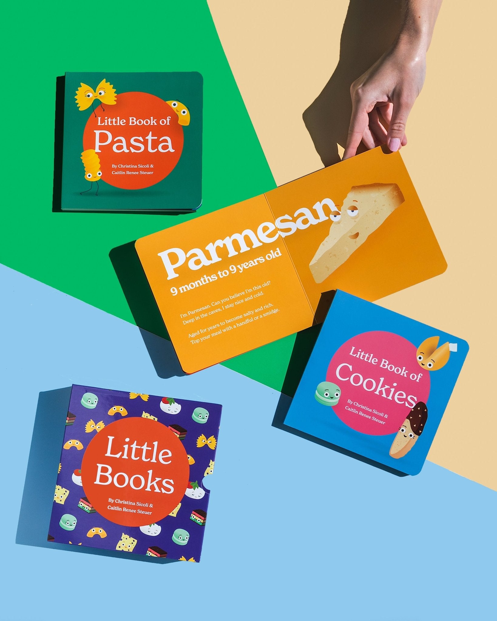 Product display featuring all elements of the "Little Books" box set: "Little Book of Pasta" (top), an open spread of "Little Book of Cheese" held by a hand and open to the Parmesan page, "Little Book of Cookies" (cover), and the complete box set (bottom)