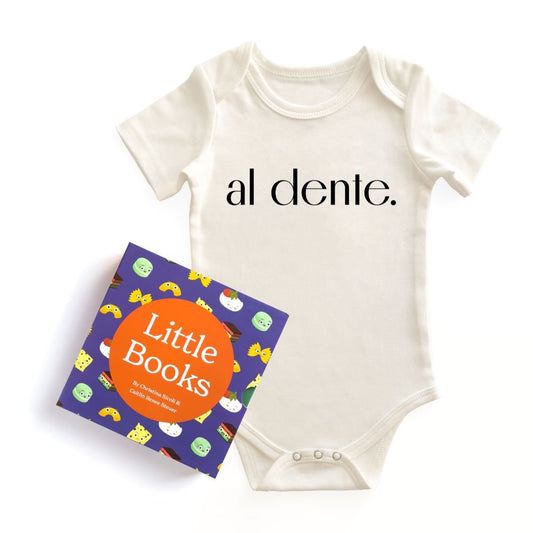 roduct image of the Pasta Sampler Set, featuring a natural cotton "Al Dente" baby bodysuit and the "Little Books" box set (Little Book of Pasta, Little Book of Cheese, Little Book of Cookies) on a white background. Chunky Deli product image.