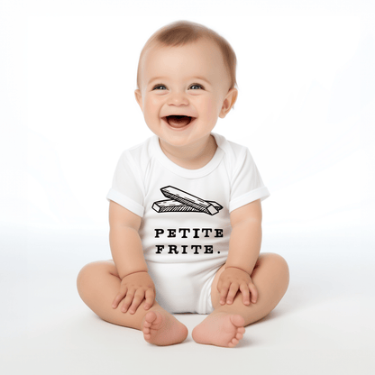 Chunky Deli product image: Happy, smiling baby wearing the "Petite Frite" onesie, showcasing the short sleeves, envelope shoulder, and graphic design across the chest. White background.