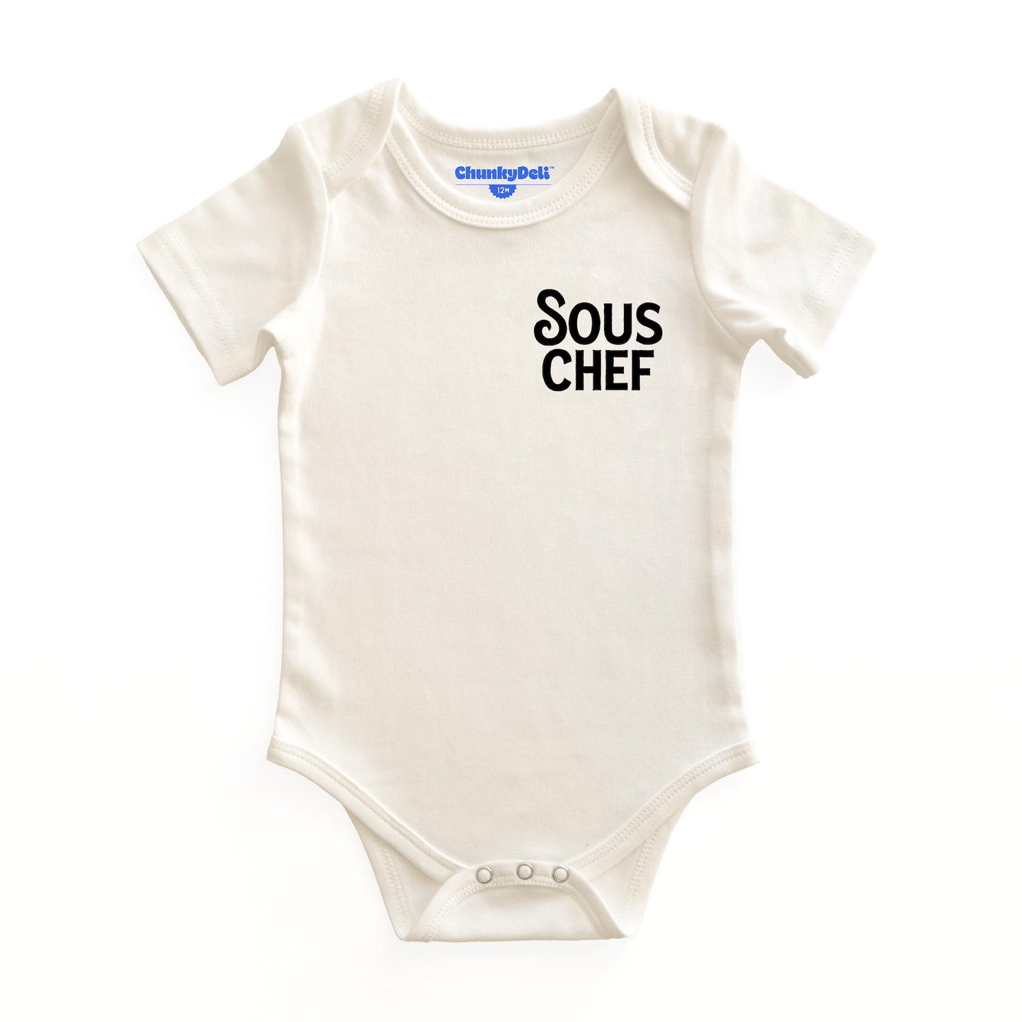 Chunky Deli product image: Natural-colored "Sous Chef" onesie (100% cotton) laid flat on a white background, showcasing the envelope shoulders and three-snap closure.