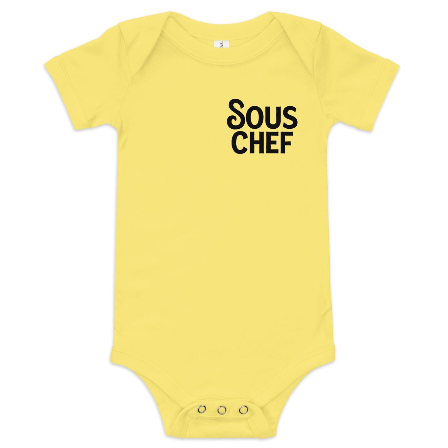 Chunky Deli product image: Yellow-colored "Sous Chef" onesie (100% cotton) laid flat on a white background, showcasing the envelope shoulders and three-snap closure.