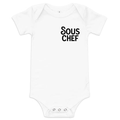 Chunky Deli product image: White-colored "Sous Chef" onesie (100% cotton) laid flat on a white background, showcasing the envelope shoulders and three-snap closure.