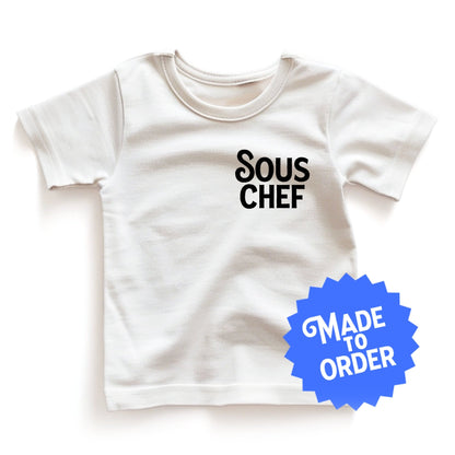 Chunky Deli product image: White short-sleeved kids' and toddler t-shirt with the text "Sous Chef" stacked vertically in black font on the chest.