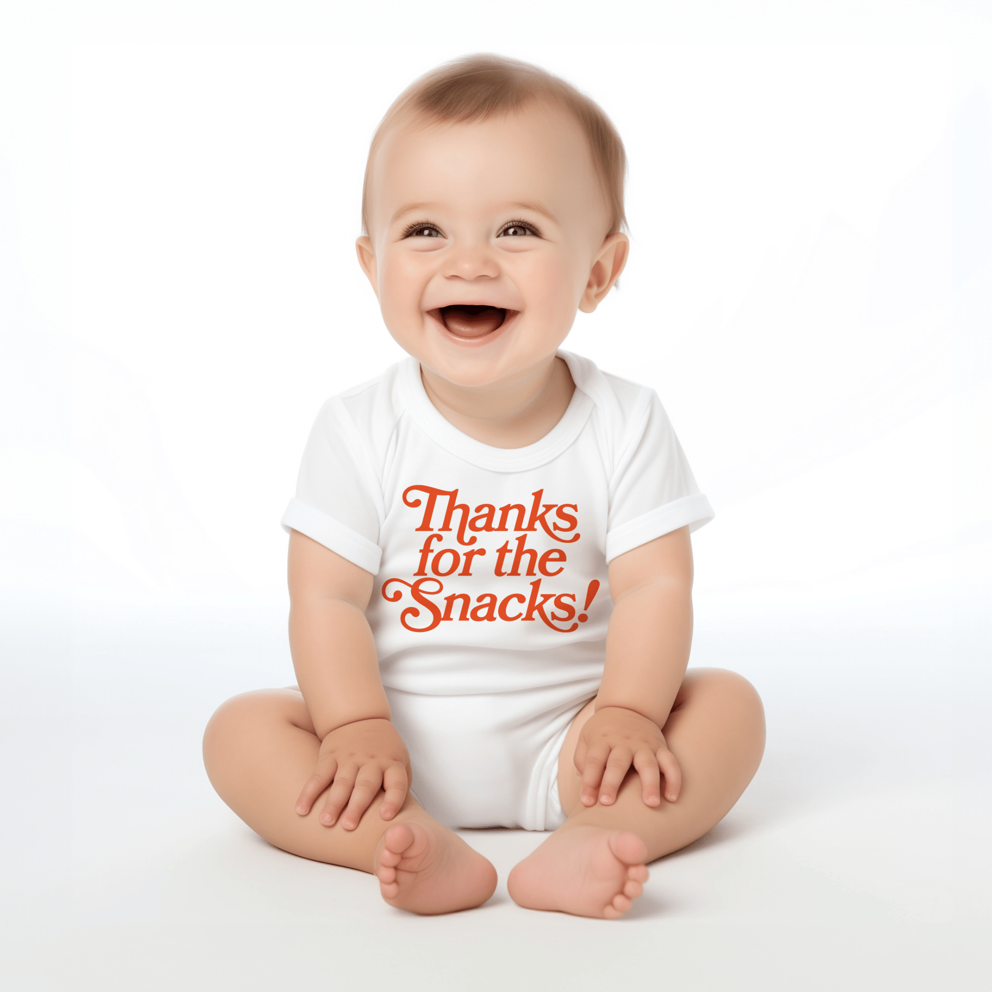 Chunky Deli product image: Happy, smiling baby wearing the "Thanks for the Snacks!" onesie, showcasing the short sleeves, envelope shoulder, and graphic design across the chest. White background.